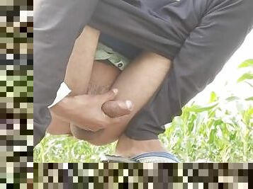 Cumming cock in village area in, outdoor.