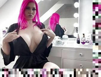 Pink haired Luvie Doll smoking slim line cigarette teasing her big bare tits with long nails