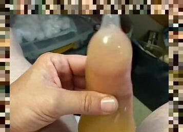 Stroking in pee filled condom