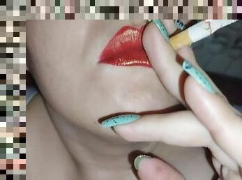 Smoking with red lipstick