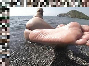 wet barefoot play on public beach 4k...