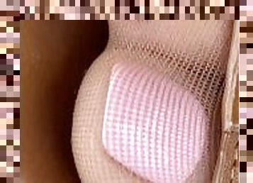 Closeup of wife's crazy cute pantyhose feet and pink toes