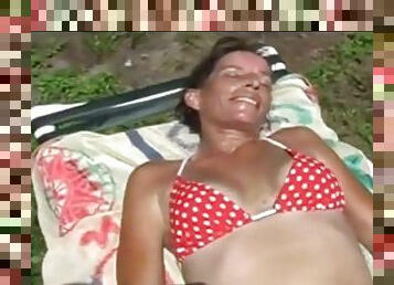 Sunbathing wife exposes