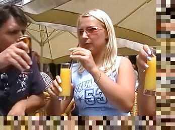 Two amazing German blondes share a cock in public