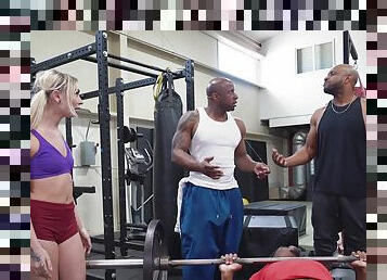 Two black stallions ass fuck a petite blonde down at the gym
