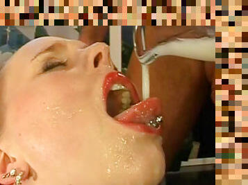 Nasty beauty is drinking tasty jizz from a plate