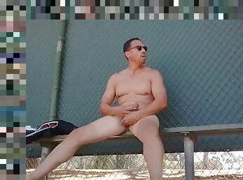 Completely naked guy-Risky Public jerk in a baseball bullpen