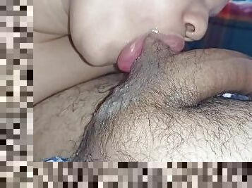 naughty girl sucking hard on a hard dick, making it very wet and sucking on the balls