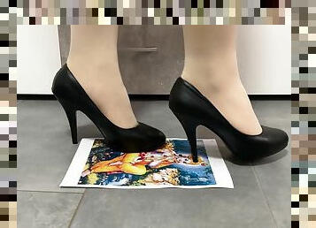 Girl trampling crushing paper in black high heels