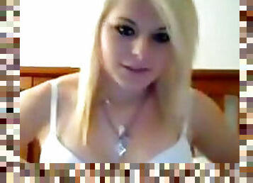Amateur blonde lifts her boobies on the webcam