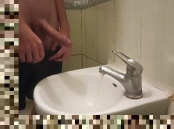 pissing my beautiful circumcised cock in the sink