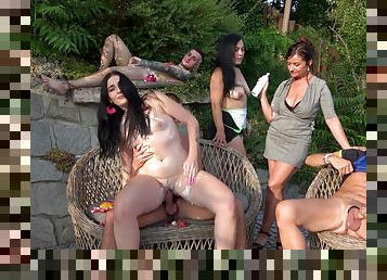 Mature ladies alongside younger whores swap dicks in outdoor orgy