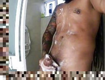 Hot tattooed rasta guy jerking off and cumming really hard in the shower