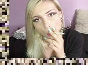 Sexy blonde girl smoke a cigarette , the return