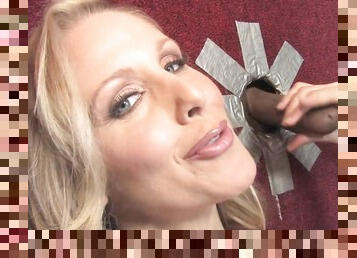 Horny mature Julia Ann pleasures a BBC and rides via gloryhole